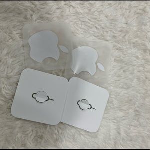 2 apple stickers and SIM card removers
